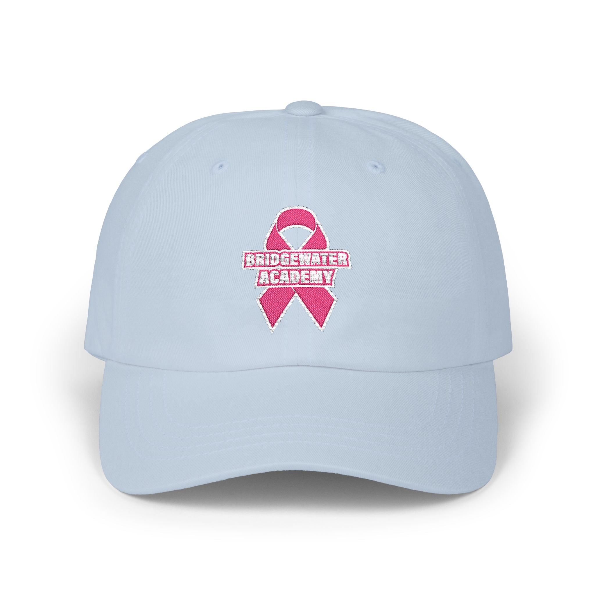 Light blue cap with pink breast cancer awareness ribbon and 'Bridgewater Academy' text on a white background