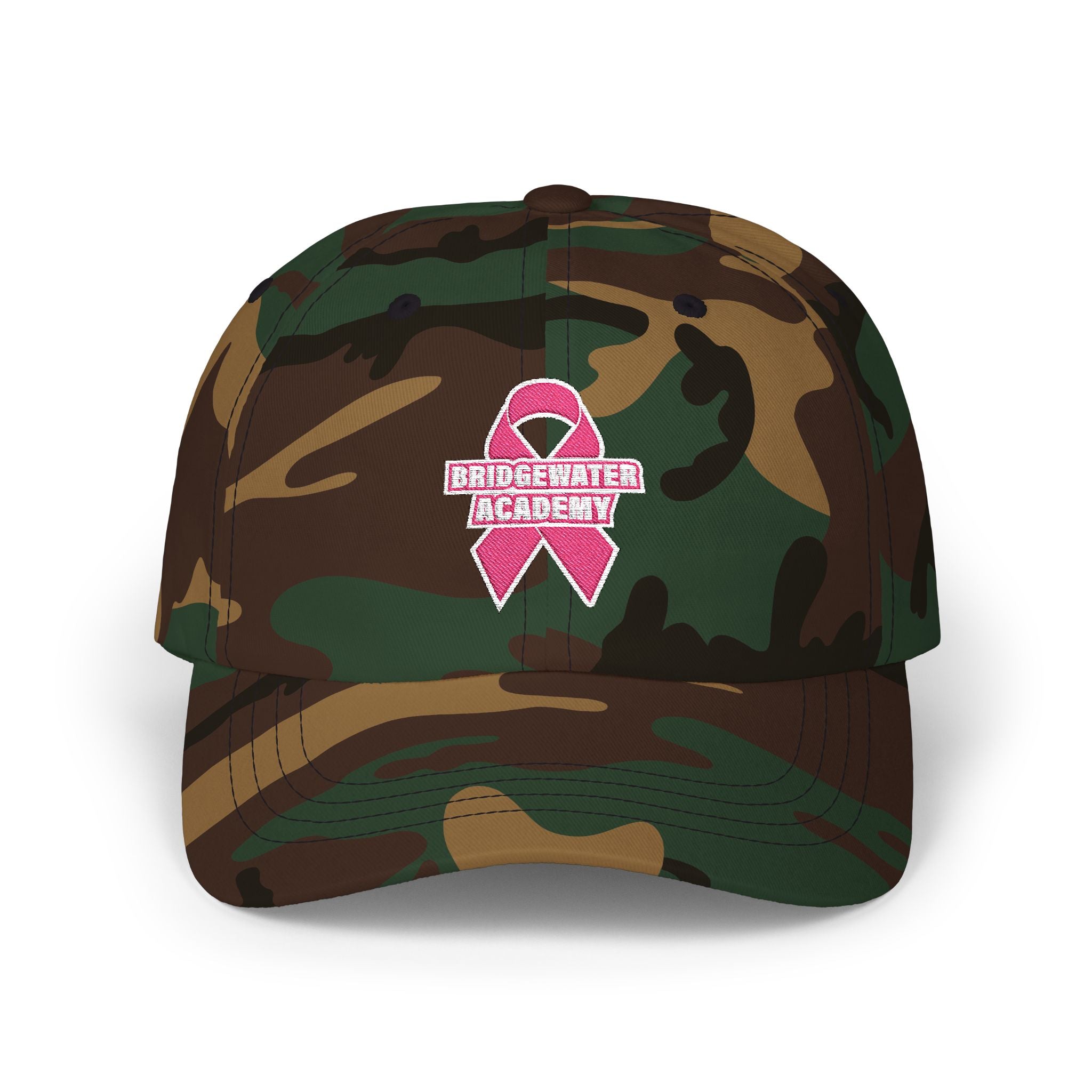 Camouflage cap with a pink ribbon and 'Bridgewater Academy' logo on a white background
