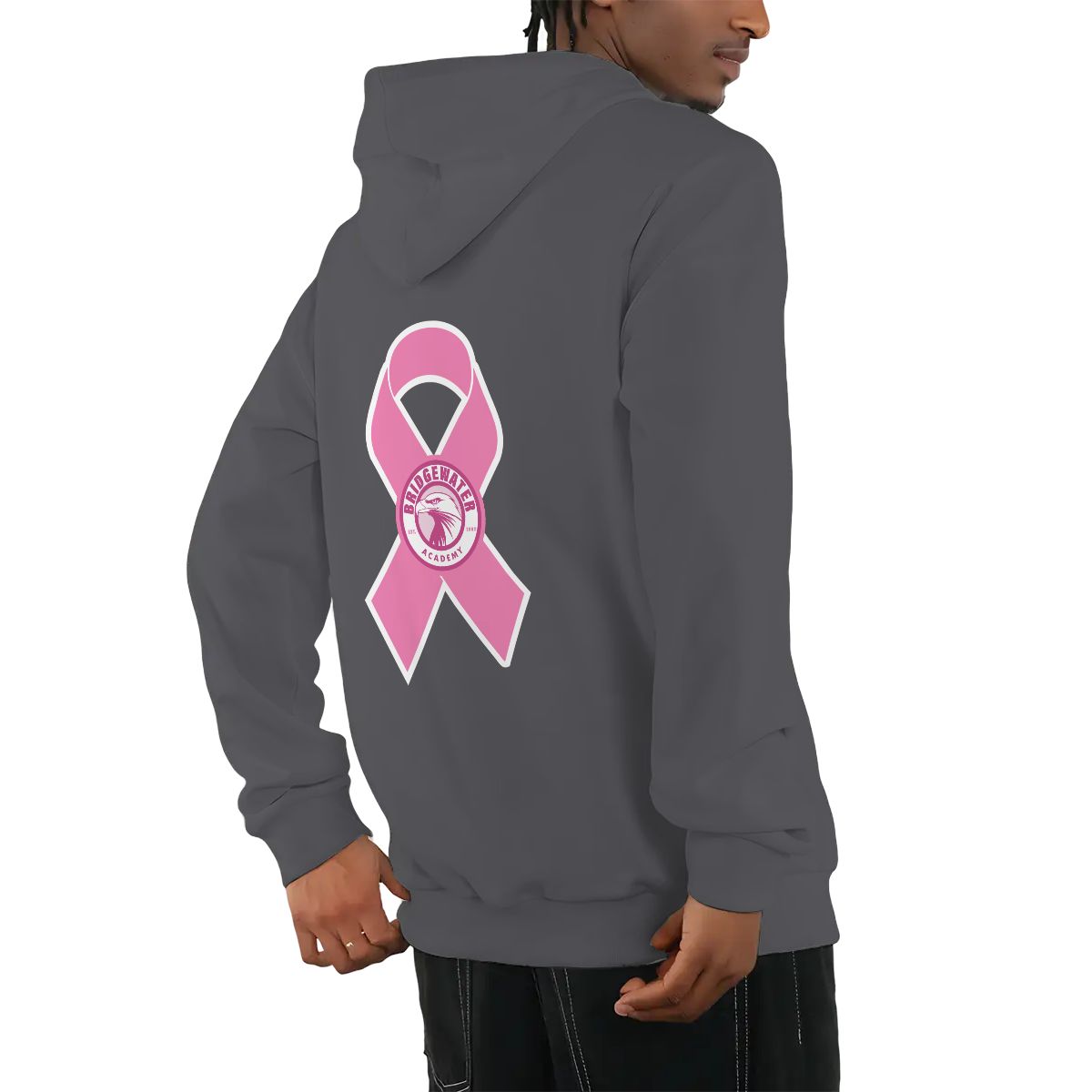 Person wearing a gray hoodie with a pink breast cancer awareness ribbon on the back.