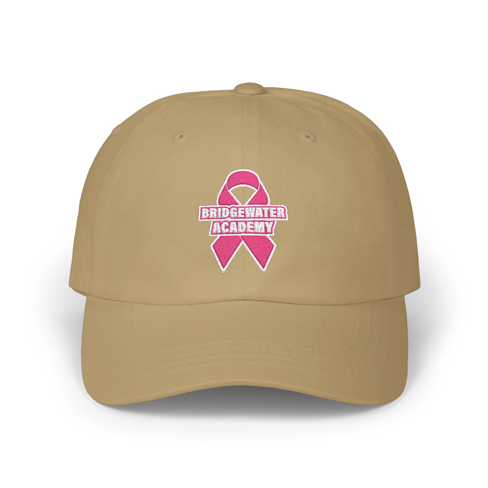 Beige cap with pink breast cancer awareness ribbon logo and 'Bridgewater Academy' text on a white background